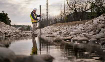Worker doing land survey